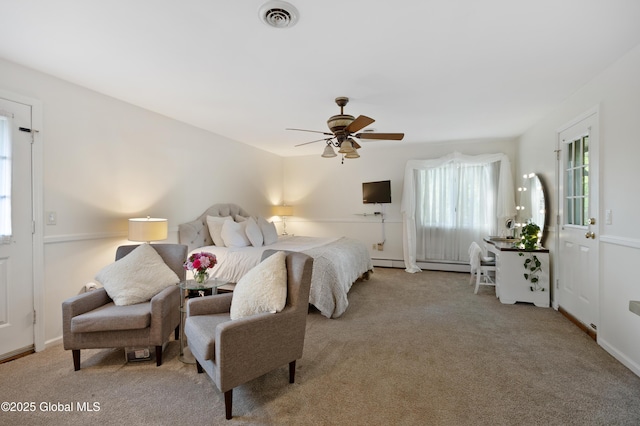 bedroom featuring carpet, ceiling fan, and a baseboard radiator