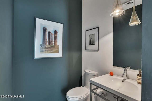 18 Granite St, Saratoga Springs, NY 12866 - bathroom with toilet and vanity