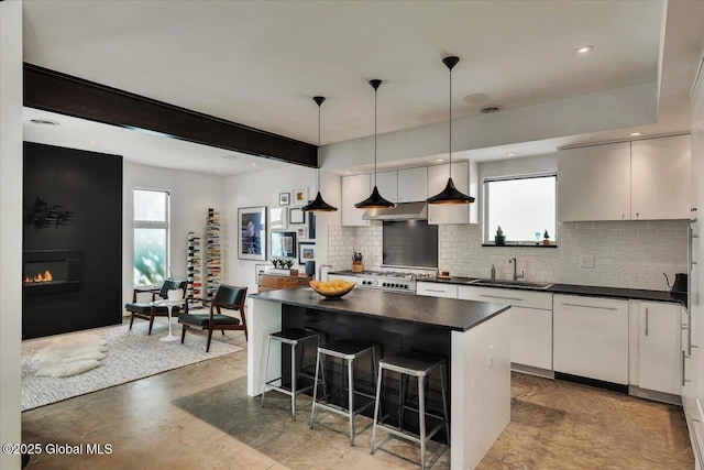 18 Granite St, Saratoga Springs, NY 12866 - kitchen with dark countertops, backsplash, healthy amount of natural light, a sink, and recessed lighting