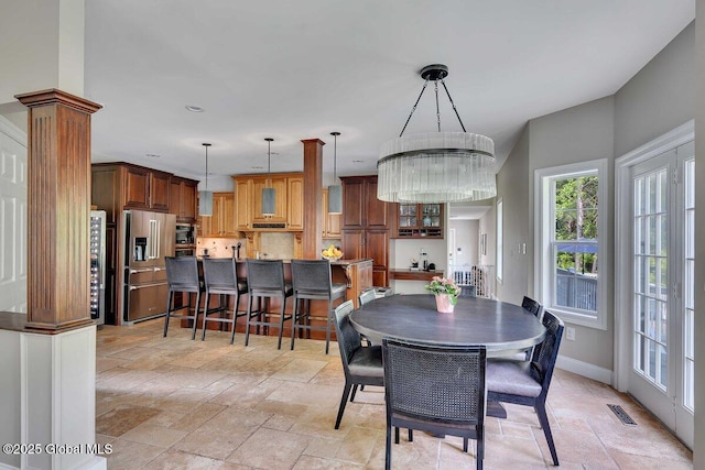 9 Meghan Ct, Wilton, NY 12866 - dining area with stone tile flooring and baseboards