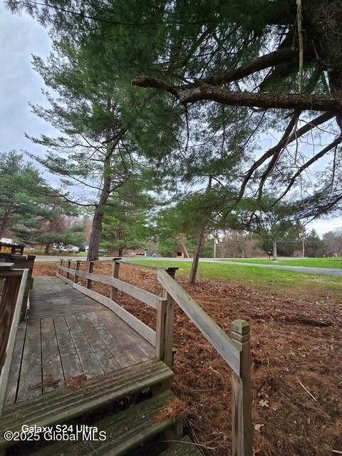 surrounding community with a wooden deck