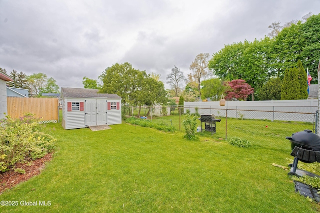 view of yard featuring a storage shed and an outbuilding