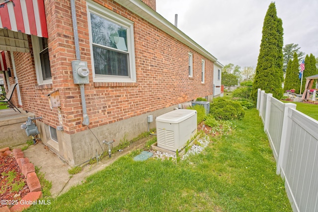 view of side of property with brick siding