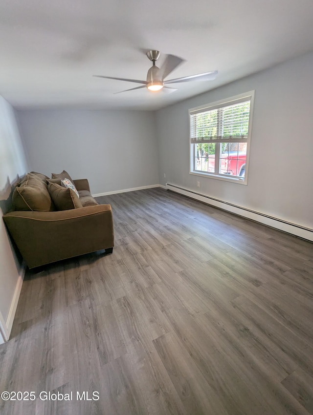 14 W Main St, Fort Plain, NY 13339 - unfurnished room with ceiling fan, wood finished floors, a baseboard heating unit, and baseboards