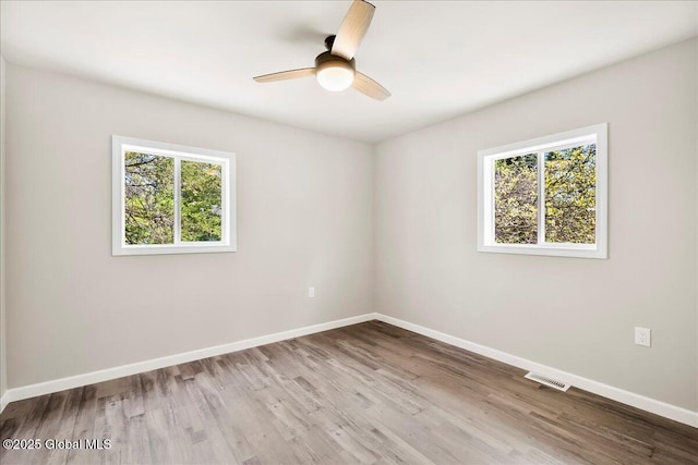 35 Feeder Dam Rd, Moreau, NY 12803 - spare room featuring plenty of natural light, baseboards, and wood finished floors