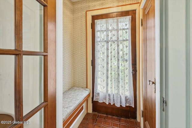 mudroom with wallpapered walls