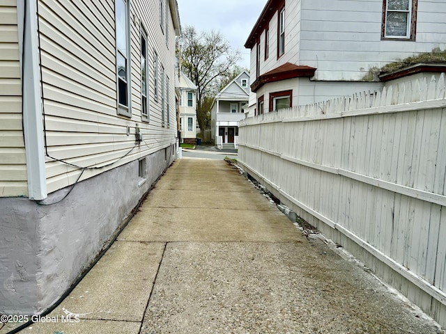 view of home's exterior with fence