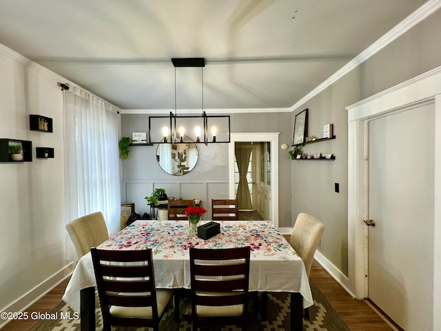 dining room with a chandelier, baseboards, dark wood finished floors, and ornamental molding