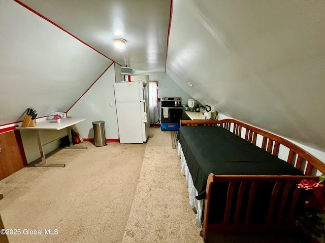 bedroom with freestanding refrigerator, lofted ceiling, light carpet, and baseboards