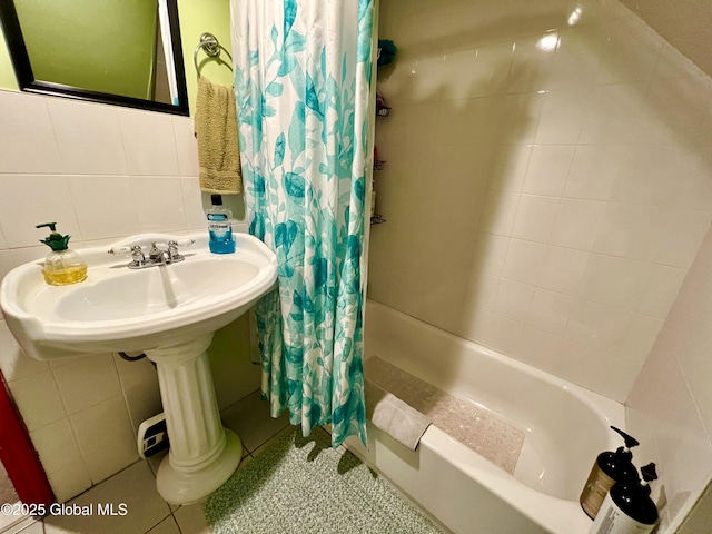 full bathroom featuring shower / tub combo with curtain and tile patterned flooring