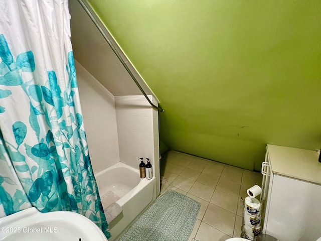 bathroom featuring tile patterned flooring and shower / bath combination with curtain