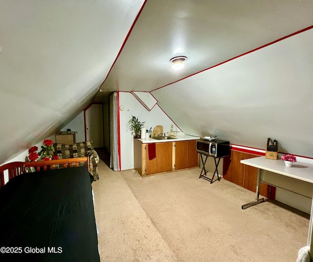 additional living space with vaulted ceiling and light carpet