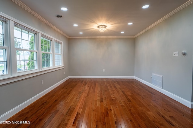 unfurnished room featuring hardwood / wood-style floors, ornamental molding, recessed lighting, and baseboards