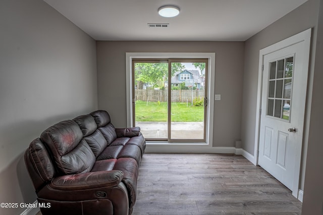 living room with wood finished floors and baseboards