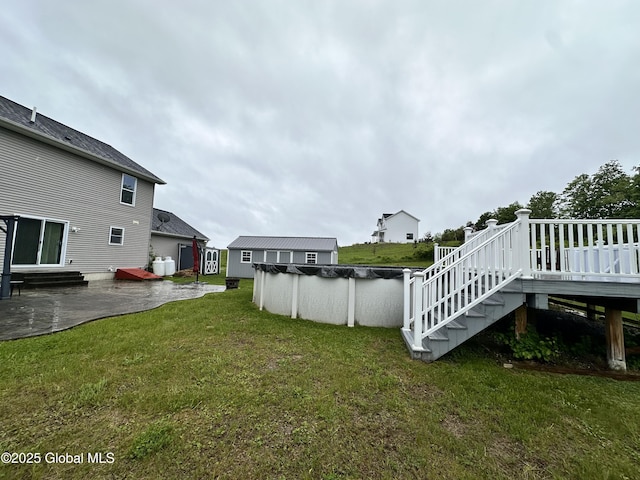23 Line Dr, Brunswick, NY 12180 - view of green lawn with a wooden deck, a covered pool, a patio, and entry steps