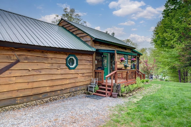 34 Rosebloom Rd, Hadley, NY 12835 - view of front facade with metal roof and a front lawn