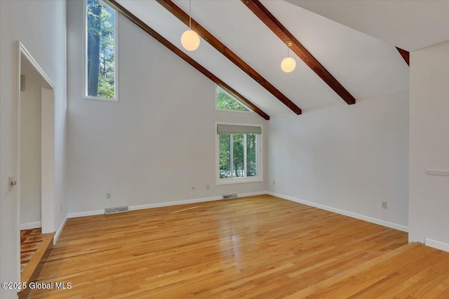 15 Westcrest Dr, Clifton Park, NY 12065 - unfurnished living room with beam ceiling, light wood finished floors, high vaulted ceiling, and baseboards