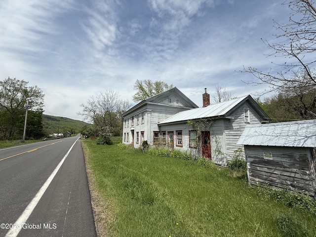 3306 Rte 145, Rensselaerville, NY 12469 - view of property exterior featuring a chimney and metal roof