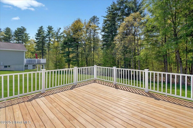 wooden deck with a yard