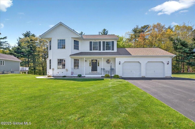 view of front of house with covered porch, a garage, asphalt driveway, and a front lawn