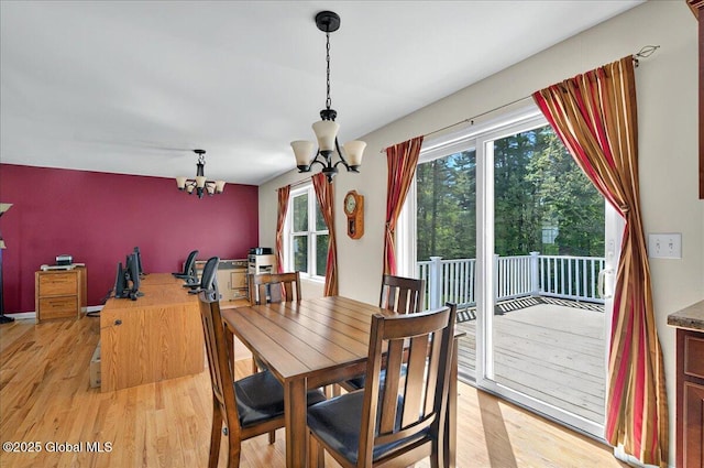 dining room featuring a chandelier and light wood-style floors