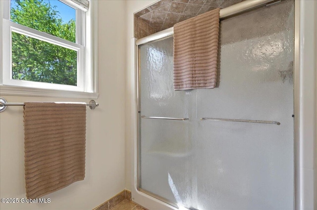 full bath featuring a shower stall