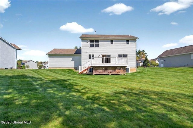 back of property featuring a deck and a yard