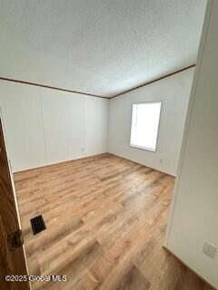 empty room with wood finished floors