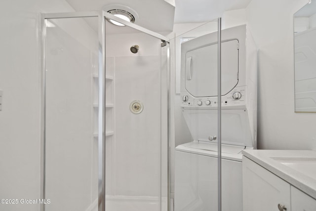 821 7th St, Rensselaer, NY 12144 - clothes washing area featuring stacked washing machine and dryer