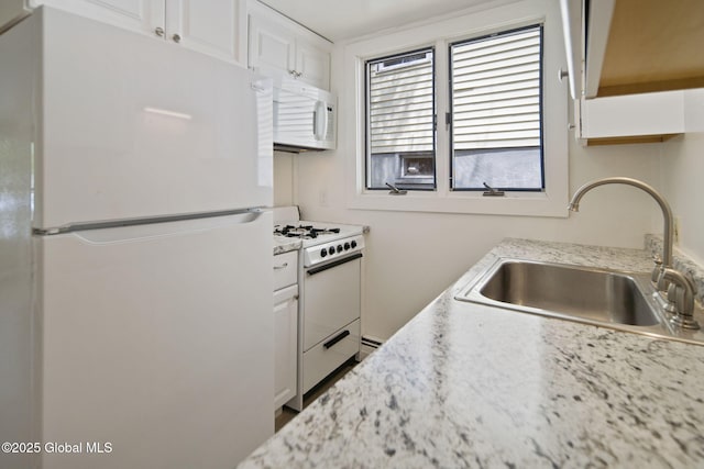 821 7th St, Rensselaer, NY 12144 - kitchen featuring white appliances, a sink, and white cabinetry