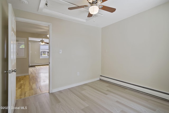 821 7th St, Rensselaer, NY 12144 - empty room featuring baseboard heating, a ceiling fan, wood finished floors, and a raised ceiling
