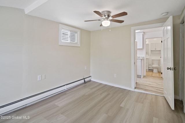 821 7th St, Rensselaer, NY 12144 - unfurnished bedroom with baseboard heating, light wood-type flooring, baseboards, ensuite bathroom, and a ceiling fan