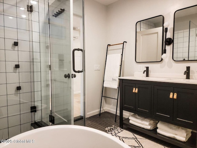 177 Glen Lake Rd, Queensbury, NY 12845 - bathroom featuring a stall shower, a soaking tub, double vanity, and baseboards
