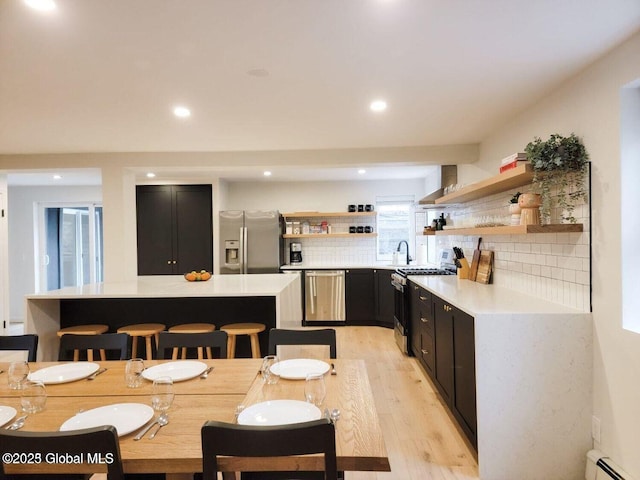177 Glen Lake Rd, Queensbury, NY 12845 - dining room with baseboard heating, light wood-type flooring, and recessed lighting