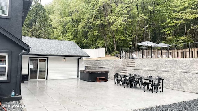 177 Glen Lake Rd, Queensbury, NY 12845 - view of patio with a hot tub, fence, and a view of trees