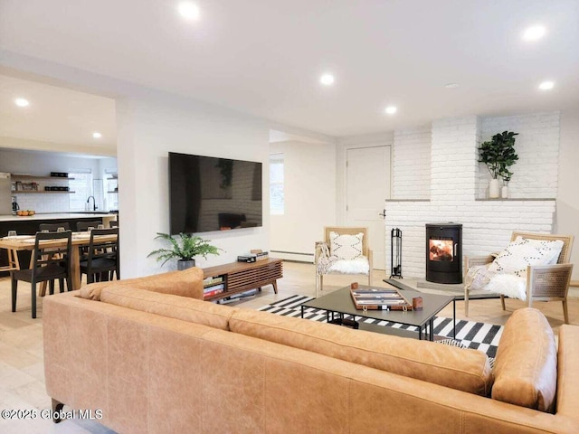 177 Glen Lake Rd, Queensbury, NY 12845 - living area featuring a brick fireplace, recessed lighting, and a baseboard radiator