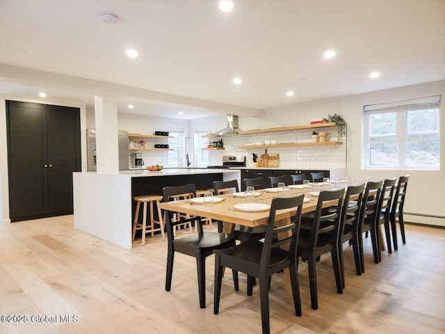 177 Glen Lake Rd, Queensbury, NY 12845 - dining room featuring light wood finished floors, recessed lighting, bar, and a baseboard heating unit