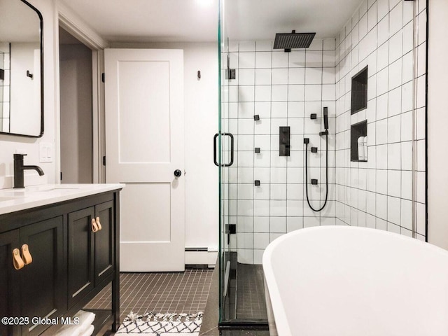 177 Glen Lake Rd, Queensbury, NY 12845 - bathroom featuring a stall shower, vanity, a freestanding tub, and tile patterned flooring