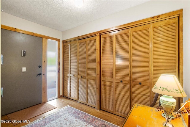 1 High Pines Ter Unit 1C, Chester, NY 12817 - entryway with wood finished floors and a textured ceiling