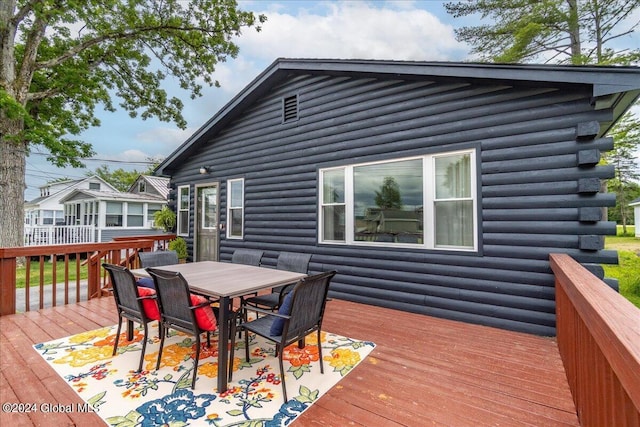 wooden deck with outdoor dining area