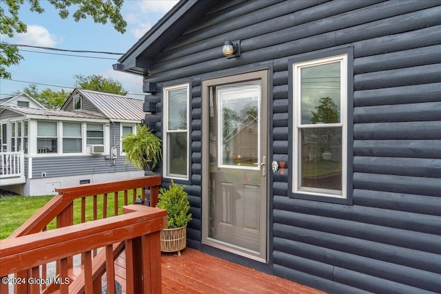 entrance to property featuring a deck