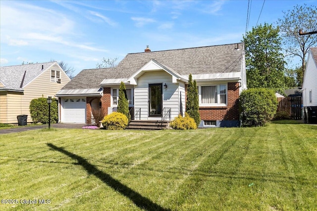 view of front of home with an attached garage, asphalt driveway, roof with shingles, brick siding, and a front yard