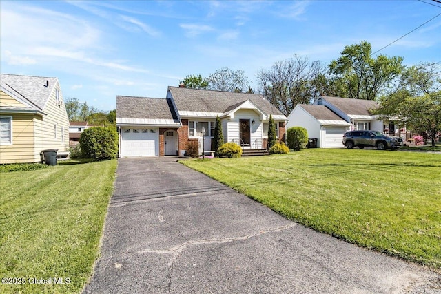 view of front of property featuring an attached garage, driveway, brick siding, and a front yard