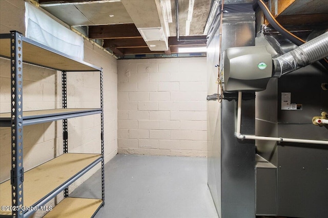 unfinished below grade area featuring concrete block wall