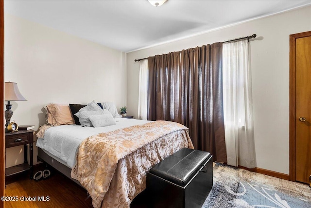 bedroom with wood finished floors