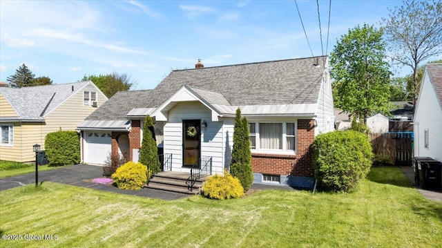 view of front of house featuring a garage, brick siding, driveway, and a shingled roof