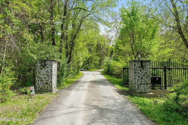 view of road featuring a forest view