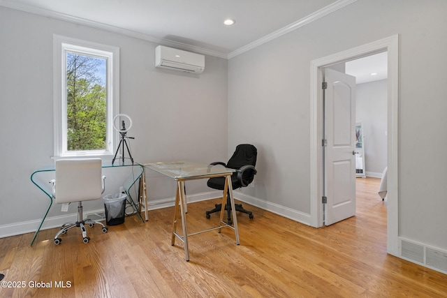 office featuring a wall mounted air conditioner, ornamental molding, light wood finished floors, baseboards, and recessed lighting