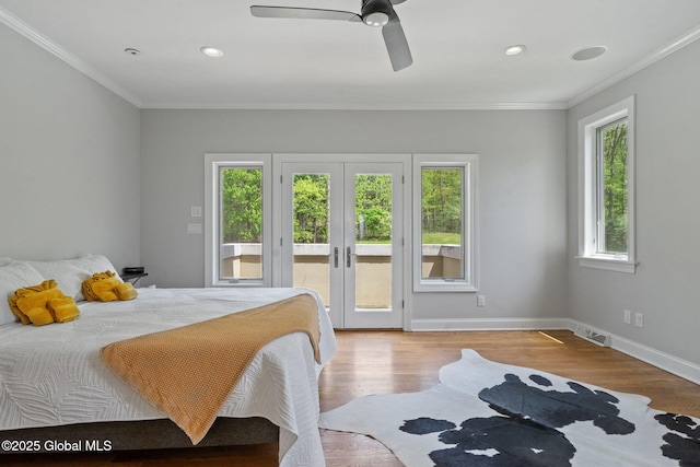bedroom with access to exterior, ornamental molding, wood finished floors, baseboards, and french doors