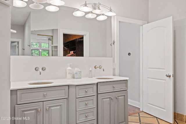 bathroom with double vanity and tile patterned floors